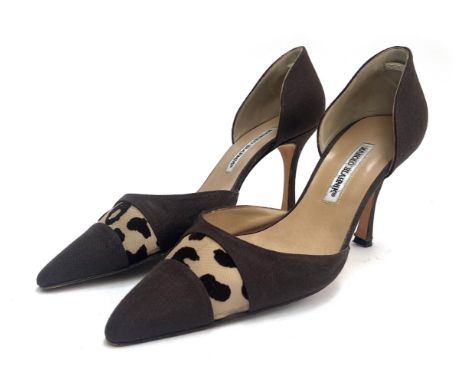 A pair of Manolo Blahnik tobacco tone heeled cocktail pumps with leopard print net panel, pointed closed toe, cream leather i