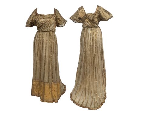A c.1910s silk evening dress, made with re-purposed 19th century sari fabric, hem with large panel of gold toned silk with br