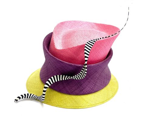 A Philip Treacy multicoloured tiered occasion hat with striped structural ribbon, together with other ladies hats, to include