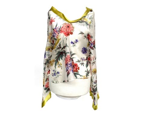 An Etro silk blouse with sheer body in floral print, tangy yellow silk trim, boatneck design, 40" chest