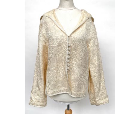 An Emanuel Ungaro hooded jacket in ivory, with woven patterned textured, covered button front, cord edgings, size 36