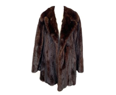 A brown mink coat with leopard print silk lining, collar and lapels, single vent, good vintage condition, 31" length, 40" che