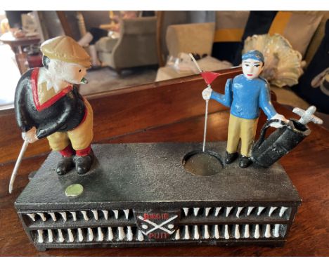 GOLF - CAST IRON GOLFING MECHANISED MONEY BOX
A large, mid-late 20th century cast iron money box with articulated golfing fig