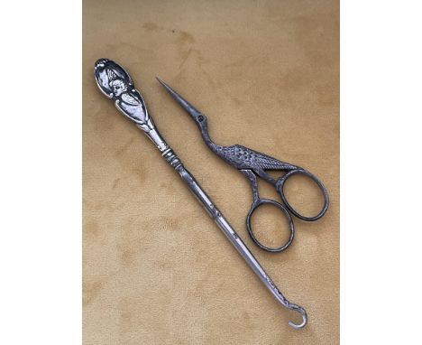 &nbsp;ENGLISH SILVER BUTTON HOOK WITH 19TH CENTURY SEWING SCISSORS
An early 20th century, English silver button hook with cha