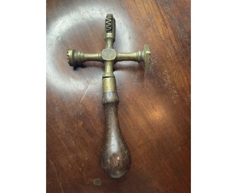 &nbsp;KITCHENALIA - 19TH CENTURY BRASS AND TREEN PASTRY JIGGER
19x10cm. A charming, antique brass and treen Pastry Jigger dat