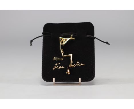 Jean Cocteau (1889-1963). "Profile". Gilt metal brooch or pin. Signed "Jean Cocteau" on the edge. Note : Published by the Com