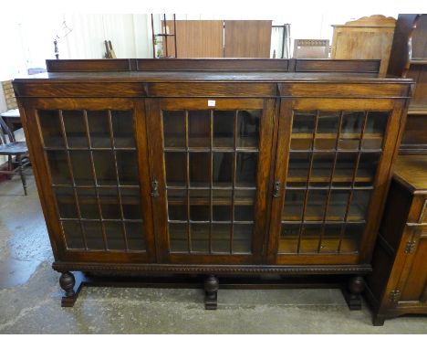 An oak three door bookcase