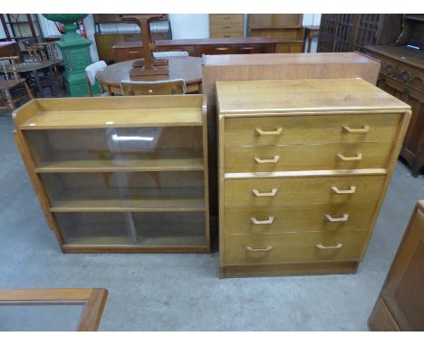 An E.Gomme, G-Plan light oak chest of drawers and a bookcase