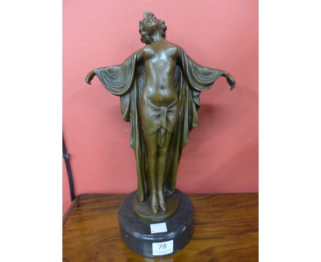 An Art Deco style bronze figure of a semi nude female, on black marble socle