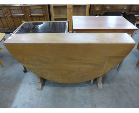 An Ercol drop-leaf dining table