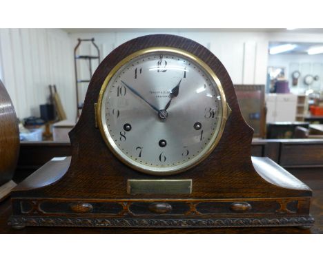 An early 20th Century oak mantel clock