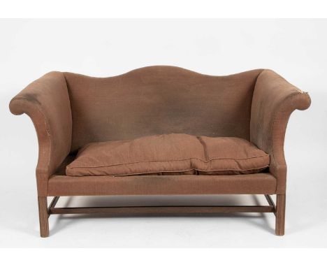 An 18th Century style camel back sofa with scroll arms and loose seat cushion on square moulded and chamfered legs, united by