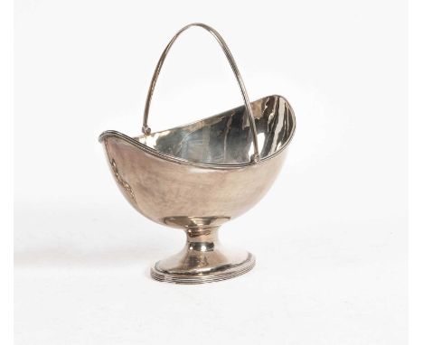 A George III swing-handled silver sugar basin, CC, London 1792, of navette shape with reeded swing handle, 16.5cm long, appro