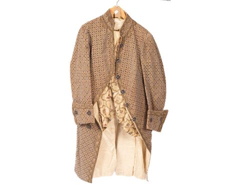 A Gentleman's frock coat, early 20th Century, velvet brocade, silk lining, length of coat 116cm approx. a floral waistcoat, b