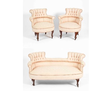 An Edwardian salon suite of small proportions comprising a sofa and two tub chairs with button back details, on cabriole legs