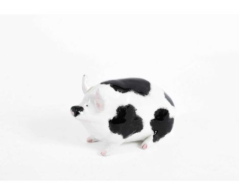 A Wemyss pottery pig with black sponge marks and pink to the ears and trotters, marked Wemyss to base, 9.5cm high x 16cm long