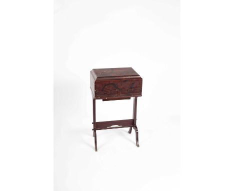 A Japanese lacquer work table, with a hinged caddy moulded lid painted with a flowering tree, fitted lift out tray interior a