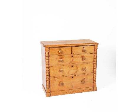 A pine chest of two short and three long drawers, turned wooden handles on a plinth base, 107cm wide, 47cm deep, 100cm highso