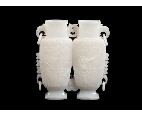 A Chinese pale jade conjoined vase with ring handles, 23cm highProvenance: Dunkirk Manor