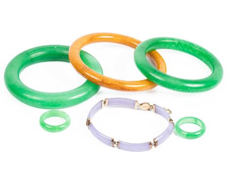 A 14k gold mounted baton link bracelet, two jade rings and three bangles