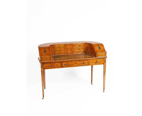 A Sheraton Revival satinwood Carlton House desk, painted with flowers and birds, an arrangement of drawers and cupboards, wit