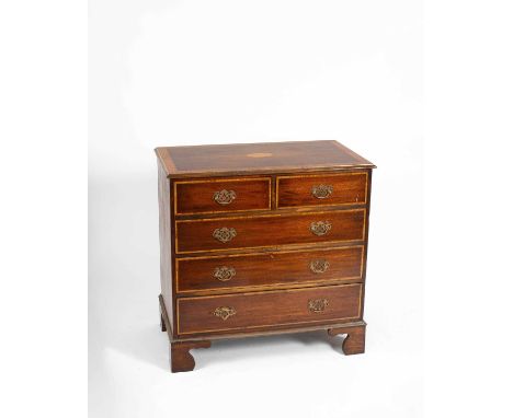 A mahogany and satinwood crossbanded chest the rectangular moulded edge top with shell inlay, with two short over three long 