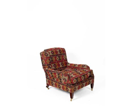 A George Smith Lennagan pattern armchair upholstered in kilim design fabric, on square tapering front legs with castors, 86cm