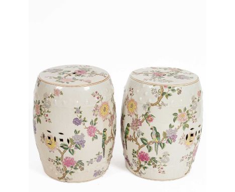 A pair of Chinese ceramic barrel-shaped garden seats, decorated all over with flowering branches and birds, 32cm diameter x 4