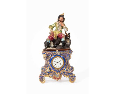 A Jacob Petit mantel clock, the porcelain case surmounted by a sailor, blue scrolling base heightened gilt, 50cm highProvenna
