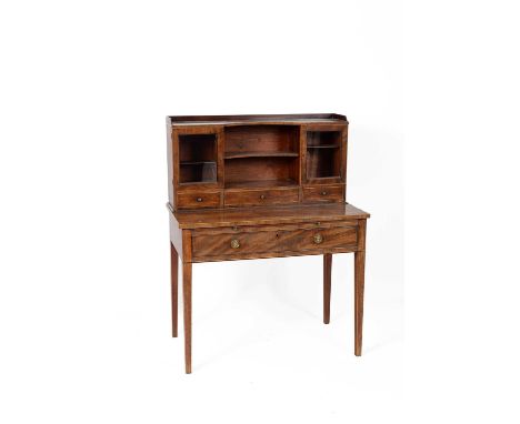 A 19th Century mahogany writing table the superstructure with a three quarter gallery top above two glazed doors flanking a c