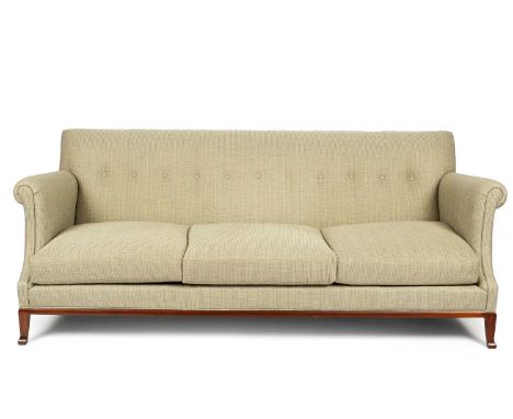 A three-seater sofa by The Hickory Chair Co. with a shallow button back, scroll arms and triple cushion seat, on a wood frame