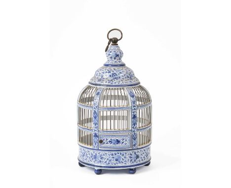 A modern Delft style hanging birdcage, 45cm highProvenance: Dunkirk ManorOne foot has a crack near the top, another with sign