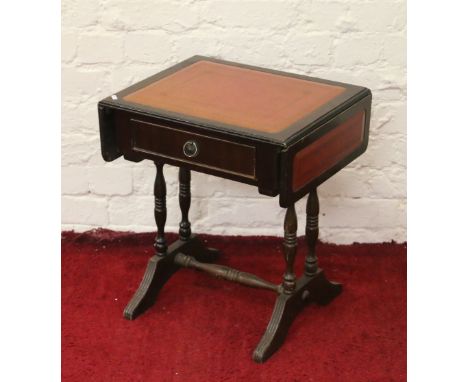 A small mahogany leather inset dropleaf sofa table.