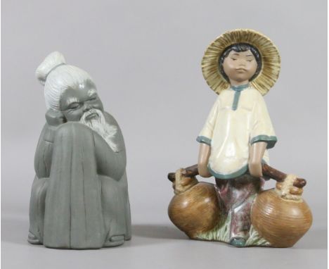 A Lladro bisque model of a young eastern girl carrying terracotta water pots along with another Lladro bisque figure formed a
