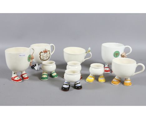 A collection of Carlton ware novelty egg cups and mugs.