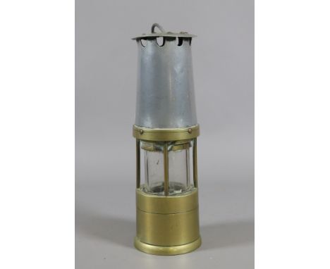 A Naylor of Wigan metal and brass miners safety lamp.