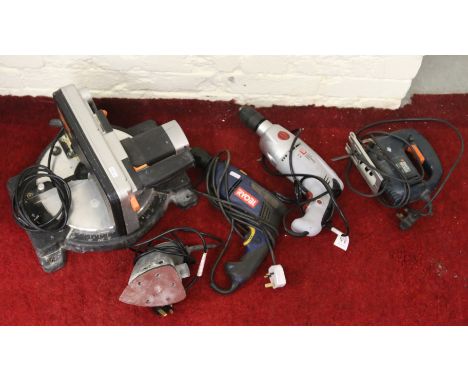 A Challanger bench top mitre saw and a 240 volt palm sander along with two electric hammer drills and a black & Decker jig sa