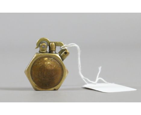 A World War II brass trench art lighter set with halfpenny.