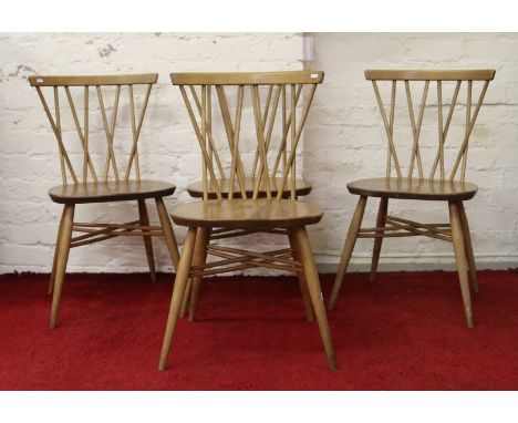 A set of four mid 20th century elm Ercol candlestick dining chairs.