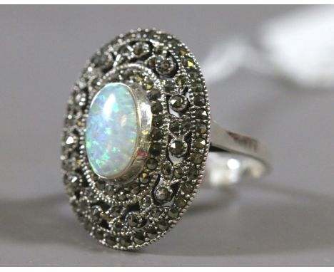 A ladies silver opal and marcasite set dress ring, UK size R.