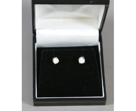 A pair of ladies 9 carat gold and opal stud earrings.