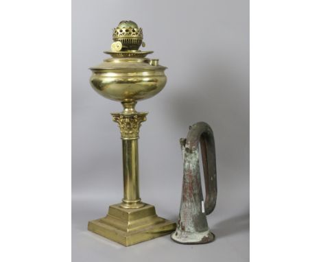 A brass based oil lamp along with a copper bugal.