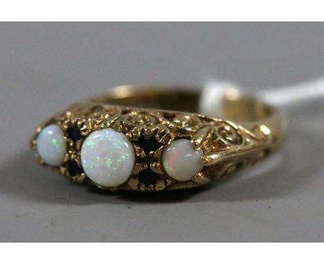 A ladies vintage 9 carat gold opal and sapphire set ring, 4.09 grams, UK size M.