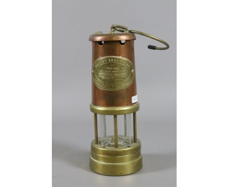 A Welsh brass and copper miners safety lamp.