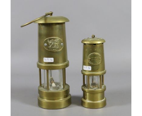 A Welsh brass cased miners lamp along with a smaller brass miners lamp.
