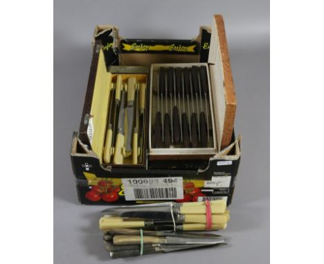 A box of assorted cutlery including bone handled and cased examples.