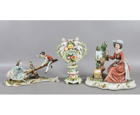 Two Capodimonte ceramic figurines of a lady painting and children on a seasaw, along with a similar twin handled vase decorat