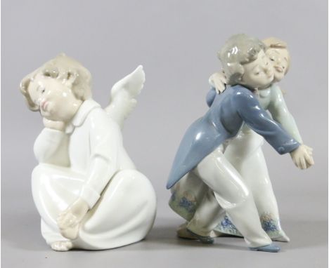 Two Lladro figures: one formed as a seated cherub and the other boy and girl dancers.