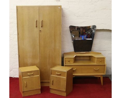 A G-plan light oak four part bedroom suite comprising double wardrobe, dressing table and two bedside cabinets.