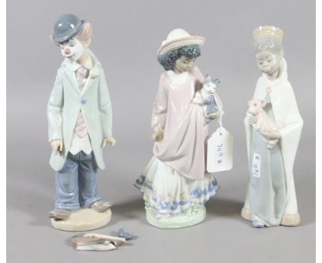 Three Lladro figures each formed as children.